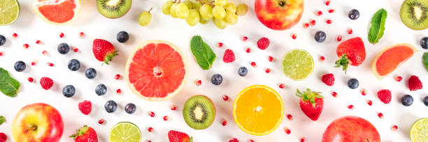 istock Fresh summer fruit overhead panoramic shot, a flat lay on a white background, vibrant food pattern 1222770112