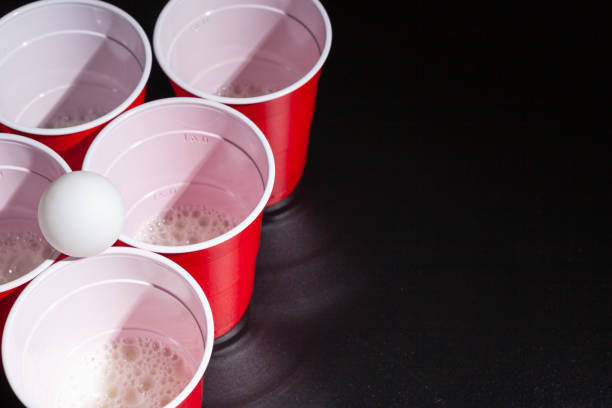 istock Beer pong college game on black background 1222771774