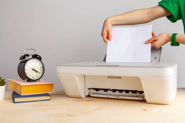 istock Close up of woman using a printer machine 1222771892