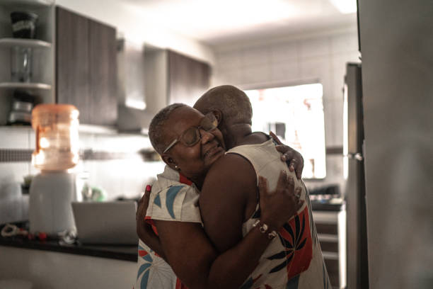 istock Mother and daughter embracing at home 1222772380