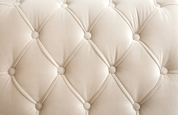 istock Light beige velour textile diamond pattern with buttons. Background concept. Furniture sofa cover. 1222772407