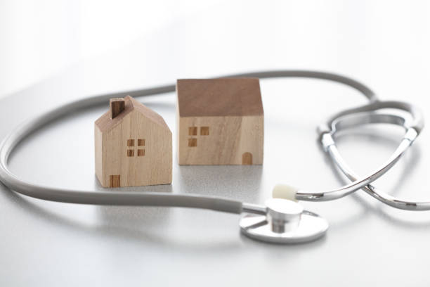 istock Miniature house and Medical stethoscope 1222772430