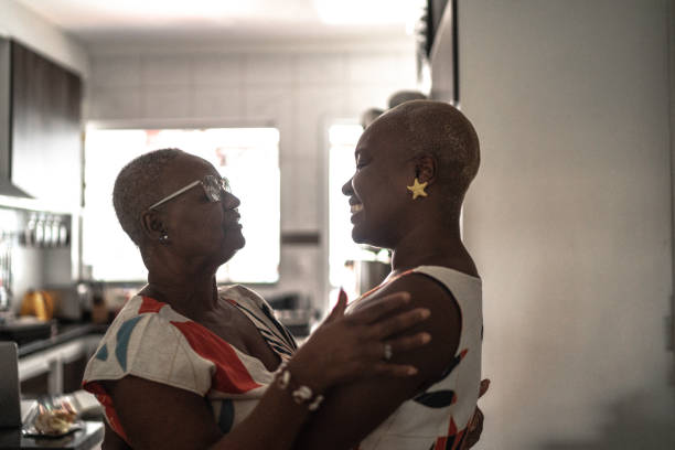 istock Mother and daughter embracing at home 1222773302