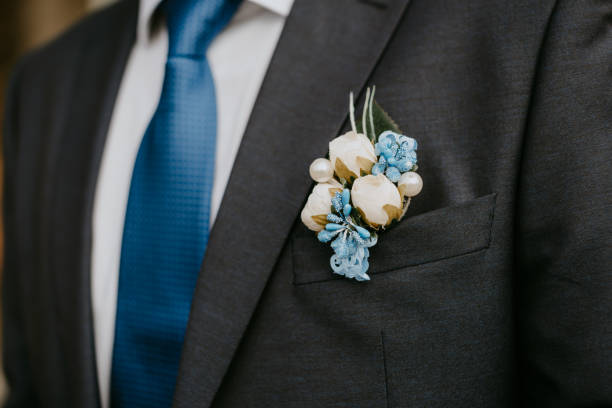 istock Artificial flower boutonniere on groom's blue jacket 1222777213