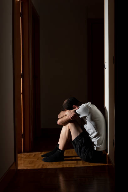 istock Man with anxiety sat in the corridor 1222777492