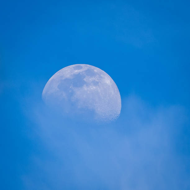 istock Half moon in the blue sky at late afternoon 1222777592