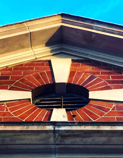 istock Round window detail in brick building 1222781573