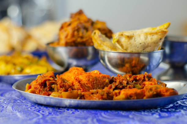 Chicken jalfrezi and chicken curry with various rice and onion Bhajis and Samosas