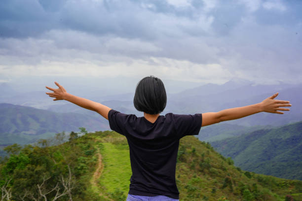 istock Female hiker admiring mountain peaks 1222785547
