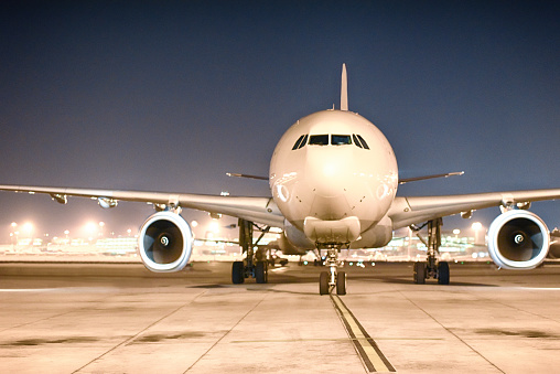 Airplane getting ready for departure at night