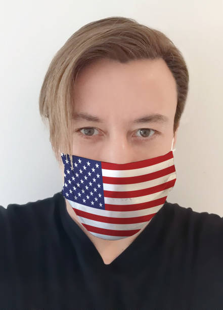 istock Young Man With American Flag Mask 1222787416