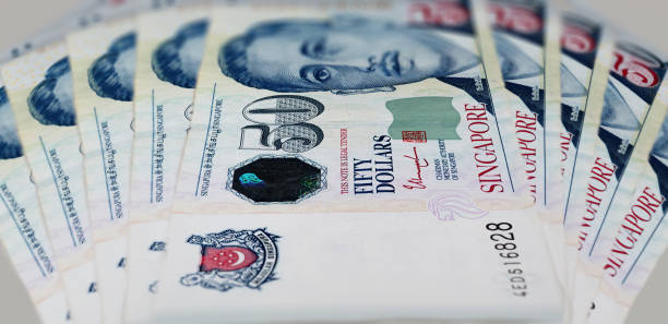 50 Singapore dollars, a close up photography A fan of 50 Singapore dollar. Currency of the City-state of Singapore. Bunch of fifty Singaporean Dollars. Paper money with the portrait of President Encik Yusof bin Ishak on the front of the note ten singapore dollar note stock pictures, royalty-free photos & images