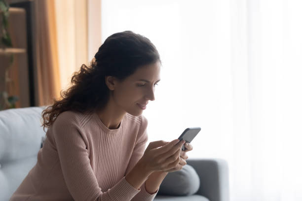istock Pretty young woman involved in pleasant conversation online. 1222788586