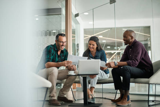 istock Casual meeting of smiling diverse business team analyzing financial data 1222788645