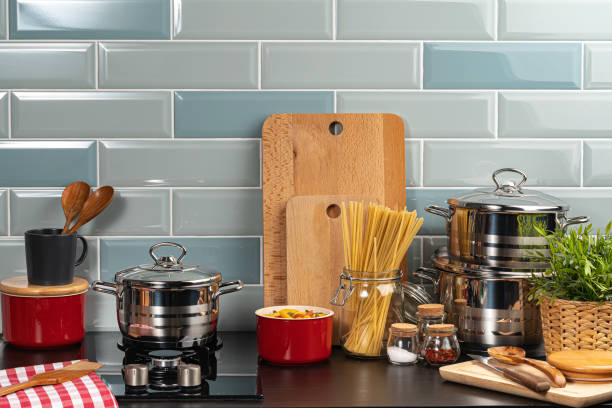 istock Dry spaghetti on a kitchen counter with cooking utensils 1222789181