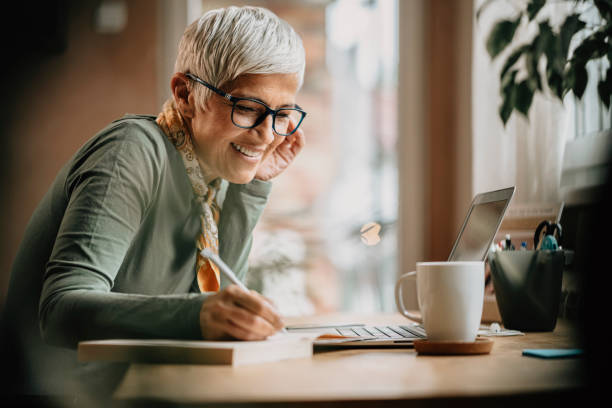 istock Mature woman working indoors at home office 1222790687