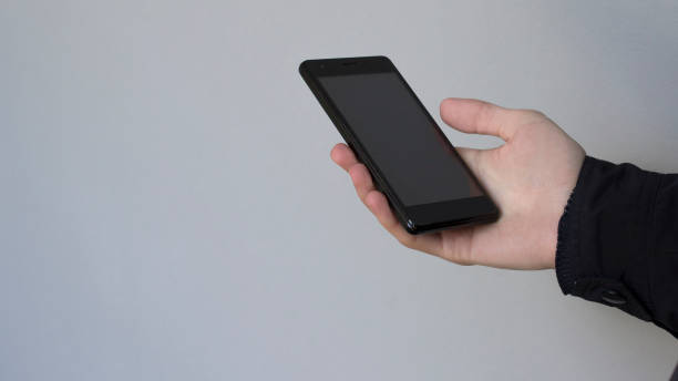 istock Man Holding Mobile Smartphone In Hand 1222792630