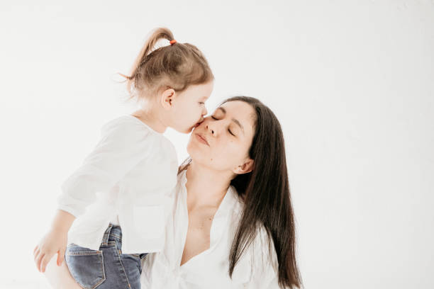 istock kisses for mom 1222793480