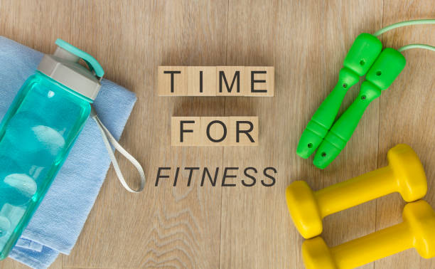 istock Fitness equipment on wooden background 1222793688