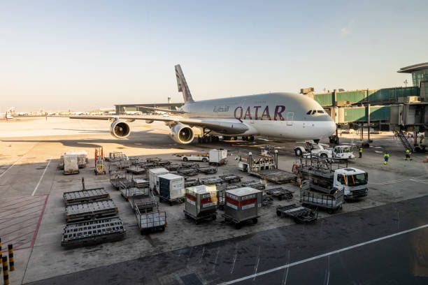 The Airport with a big jet of Doha Doha, Doha City, United Arab Emirates - January 01, 2020: The Airport with a big jet of Doha terminal tower stock pictures, royalty-free photos & images