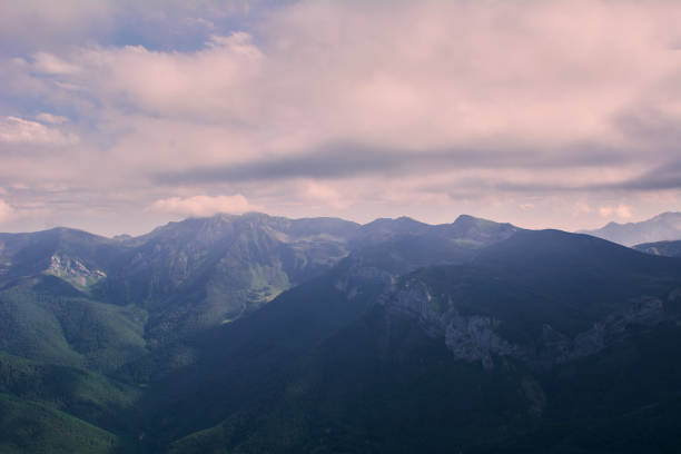 istock High mountains full of fog and clouds, 1222796213