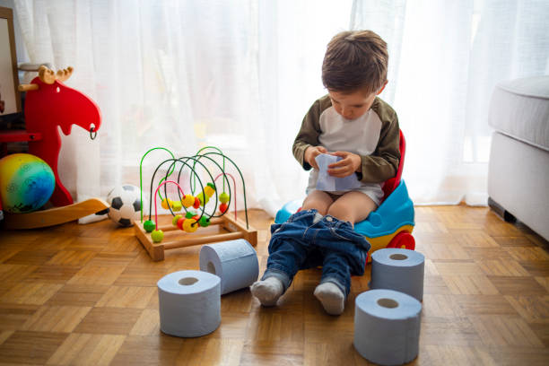 istock Sweet toddler boy, sitting on potty. 1222797925