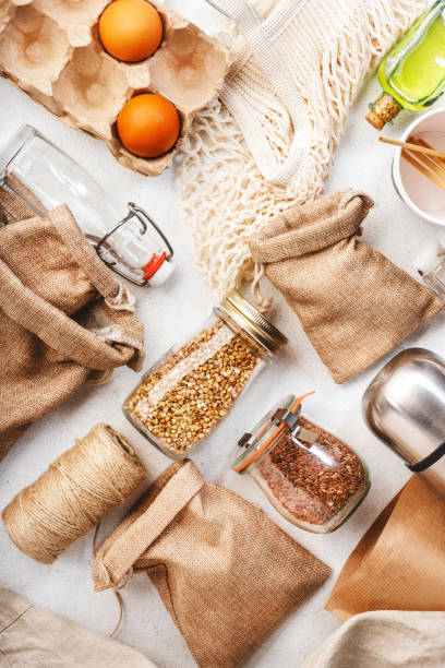 istock Zero waste, plastic free and sustainable lifestyle concept. Recyclable, reusable eco friendly bags, package, bottles, cans and storage containers, mesh bag. White background, copy space, top view 1222800043