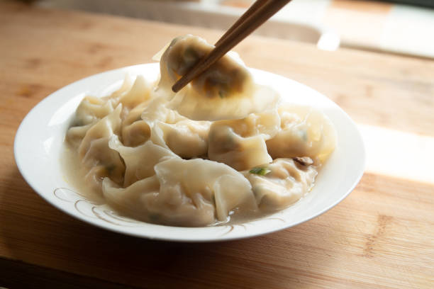 istock Eating Chinese food dumplings 1222800483