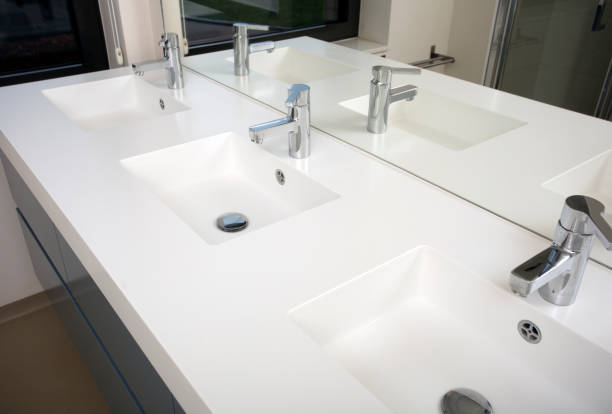 istock Three sink bathroom with three washbasin and three faucet white modern design with mirror 1222802202