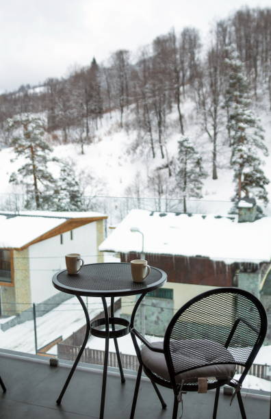 istock drink mugs on balcony, Winter time 1222803698