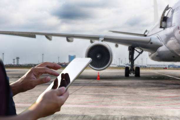 istock Male engineer using digital tablet for airplane mechanics 1222803850