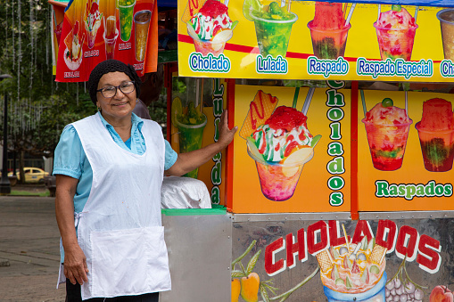 Adult woman selling cholaos in the streets of downtown Cali, Valle del Cauca, Colombia on November 19, 2019
