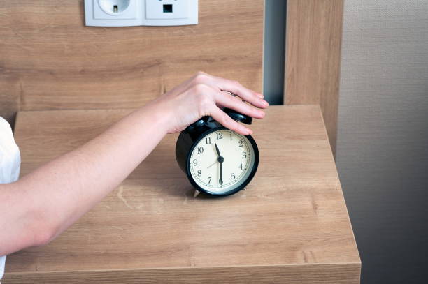 istock Alarm clock and the woman 1222806340