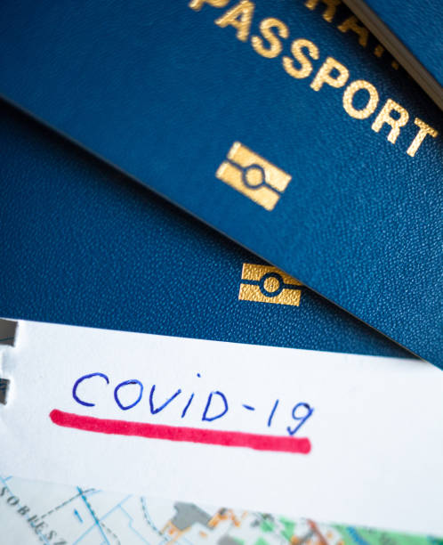 istock Passport and note with Covid-19 inscription. 1222807240