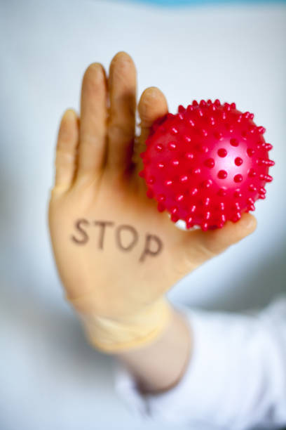 istock Stop Covid-19. Text on medical glove. 1222807874