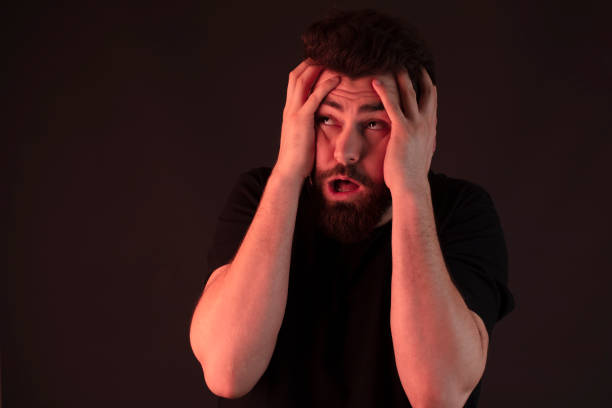 istock Male adult, stressed depressed, mental problem difficulty, medical concept. man having psychological seizure under red light. 1222808054