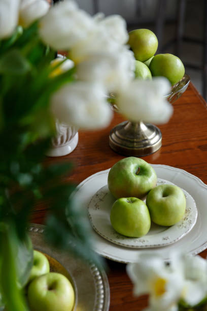 istock green apples on a porcelain plate on the table 1222808773
