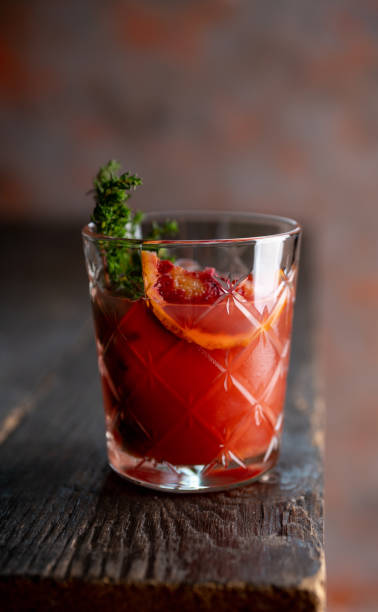 istock Old-fashioned cocktail with blood oranges and thyme on the rustic background 1222809010