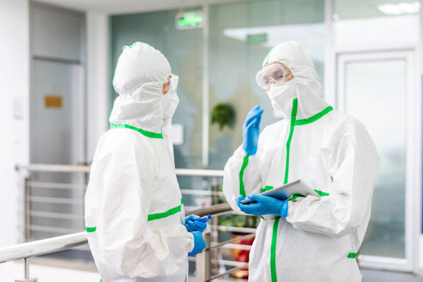 istock Two Asian doctors discuss work in the hospital 1222809749