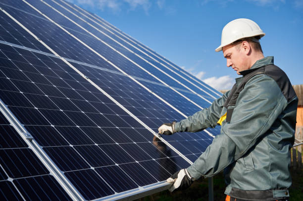 istock Male electrician checking photovoltaic solar panel. 1222813544