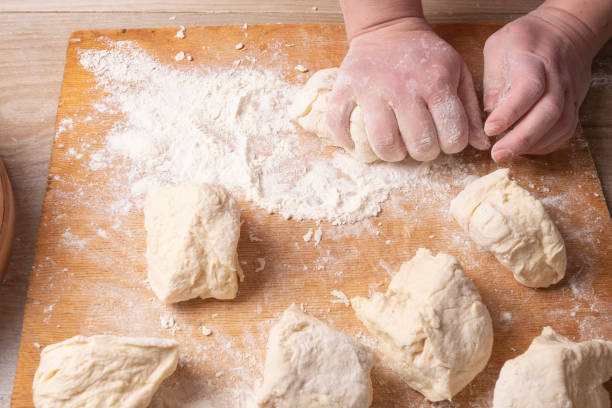 istock Female hands mixing dough in the home kitchen. 1222815204