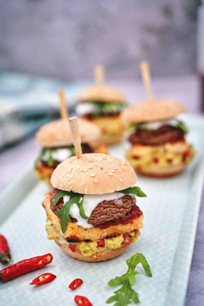 istock Mini Veggie Burger with Grilled Cheese, Mushroom, Guacamole and Arugula 1222816960