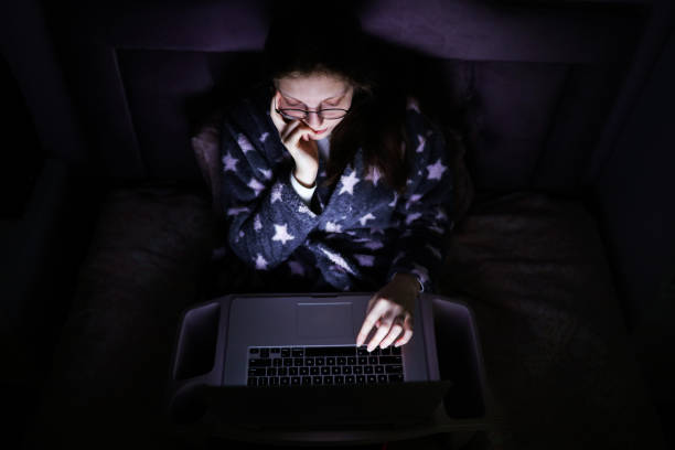 istock Young Woman Thinking On Her Laptop Computer in The Evening 1222817182