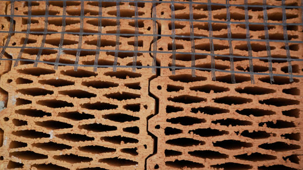 istock Ceramic building blocks stacked in a row. Ceramic blocks are in a row. Building a house from ceramic blocks. 1222817291