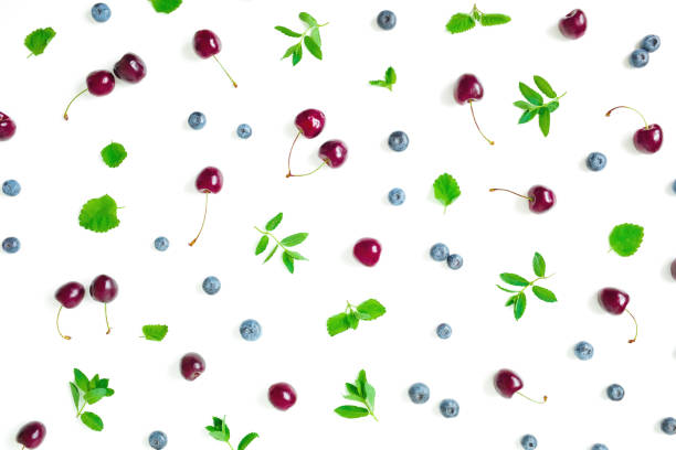 istock Cherry and blueberries with mint isolated on white background. Top view. Flat lay 1222817421