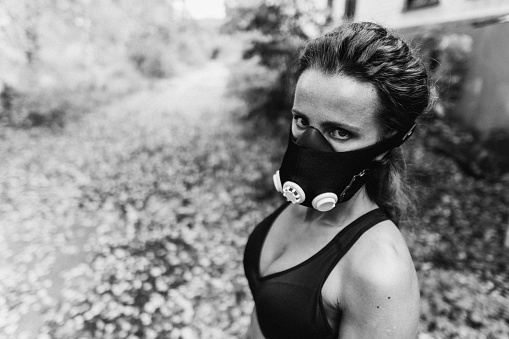 Hypoxic mask. Portrait of a girl athlete in a hypoxic mask.