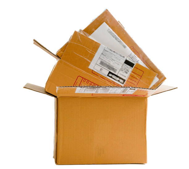istock Used delivery pacel boxes in pile on isolated white background 1222819018