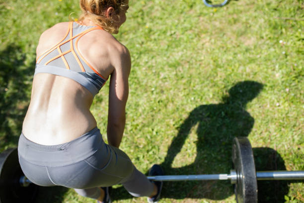 istock A strong young woman lifting weights 1222820306