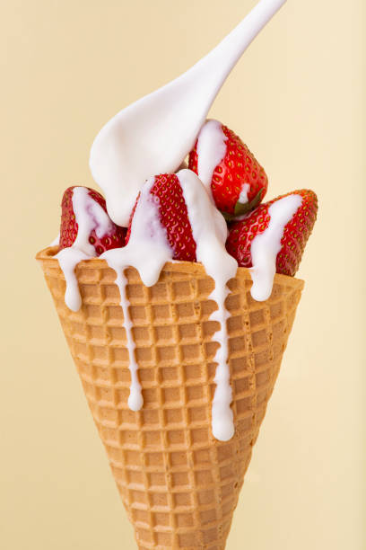 istock ice cream cone with strawberries and yogurt 1222820428