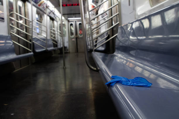 A used medical glove left on an empty subway car in NYC amidst the COVID-19 Shutdown